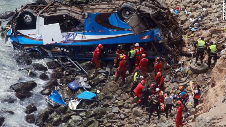 Rescue personnel work at the site of a bus accident north of Lima, capital of Peru, on Tuesday.